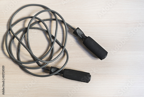 Skipping rope on wooden floor