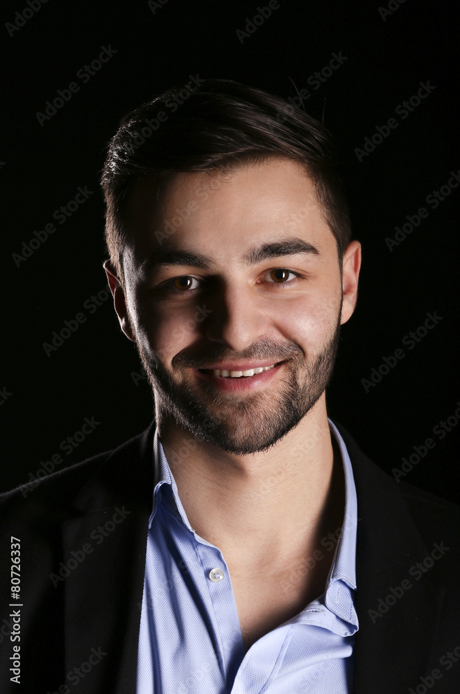 young fashion man model portrait on black background young fashion man model portrait on black background