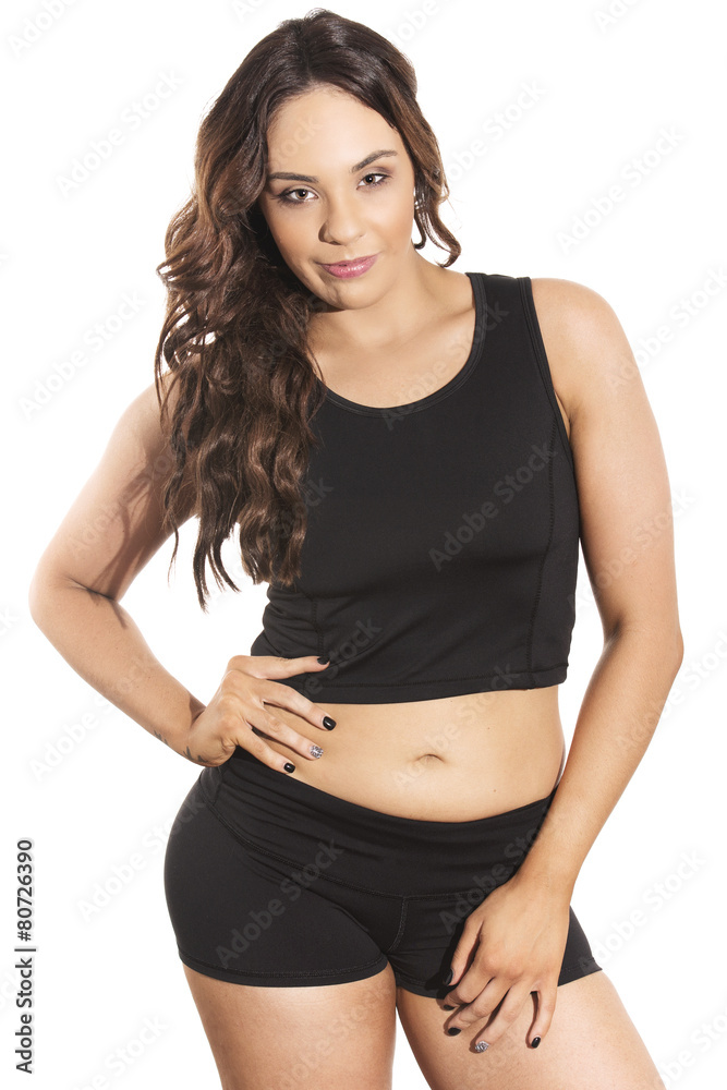 Young female fitness model posing in studio. Young female fitness model posing in studio.