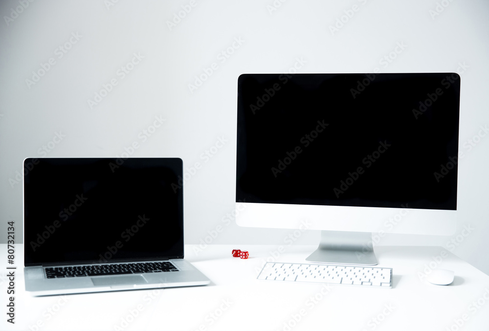 Laptop with PC on the desk in office Laptop with PC on the desk in office