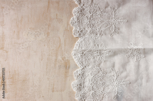 top view of vintage hand made beautiful lace fabric over wooden 