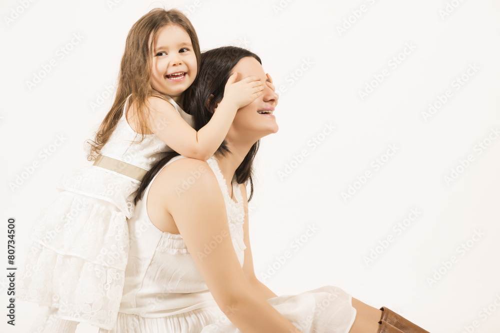 Mother and daughter having fun playing