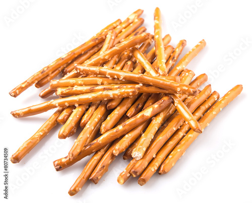 Brown, delicious pretzel sticks in a plastic container