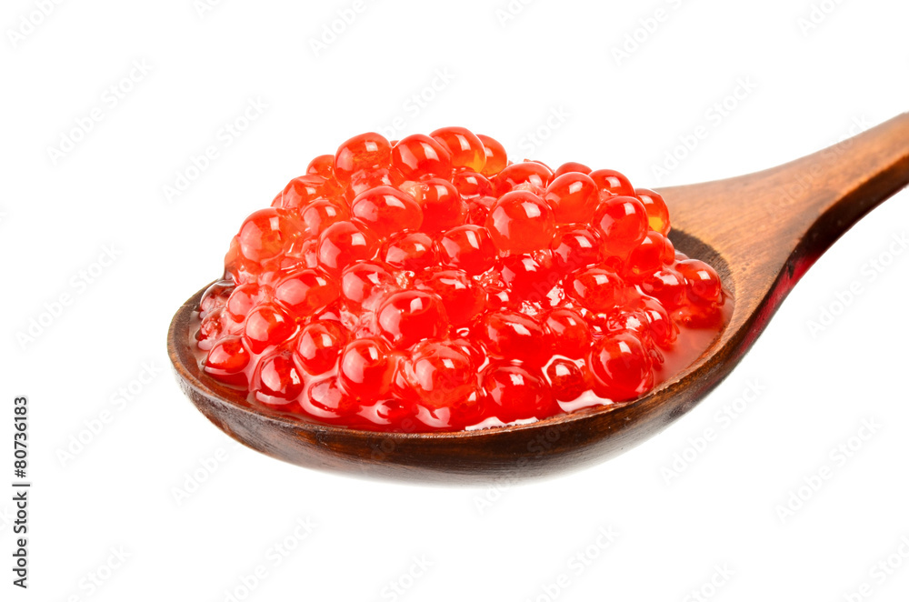 Red salted caviar with wooden spoon on white background Red salted caviar with wooden spoon on white background
