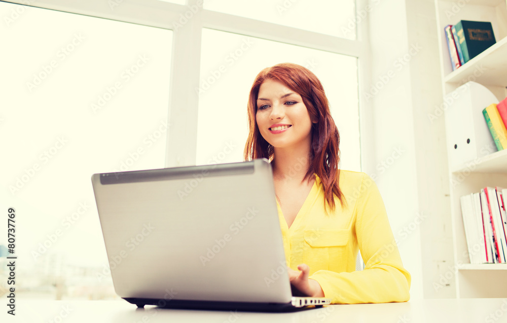 businesswoman with laptop computer in office