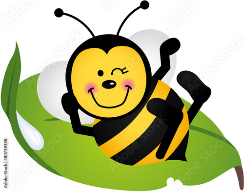 Cute bee sitting on a green leaf