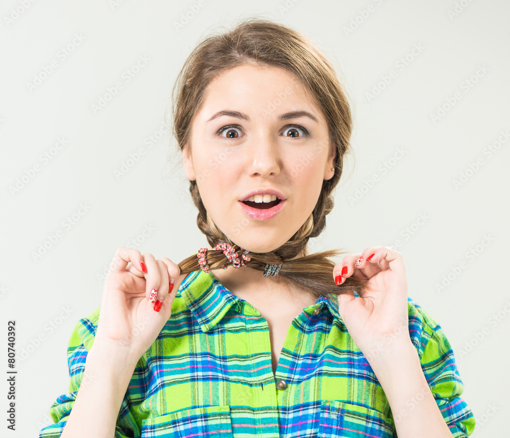 funny teen girl with pigtails around neck Stock Photo | Adobe Stock