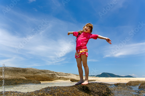 Happy child playing in sea. Summer vacations concept