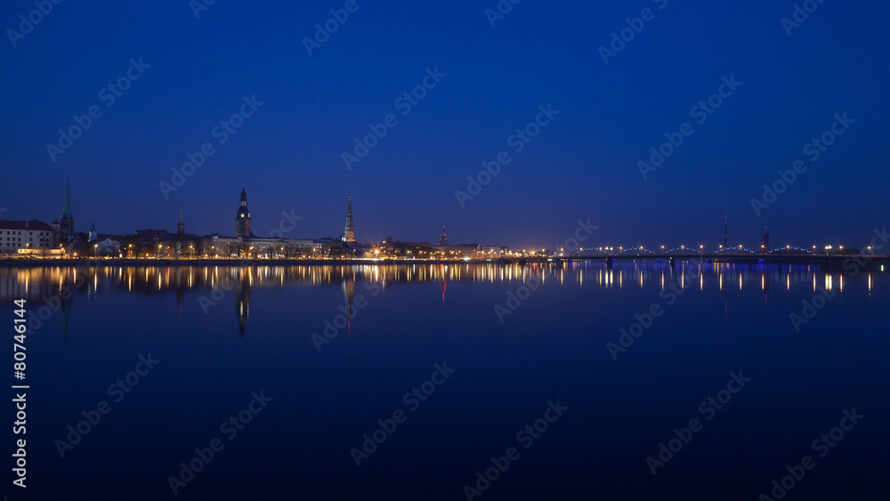 Night view of Riga centre with reflection in Daugava