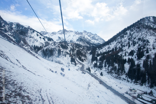 The cable car in the snowy mountains Chimbulak © frizzyfoto