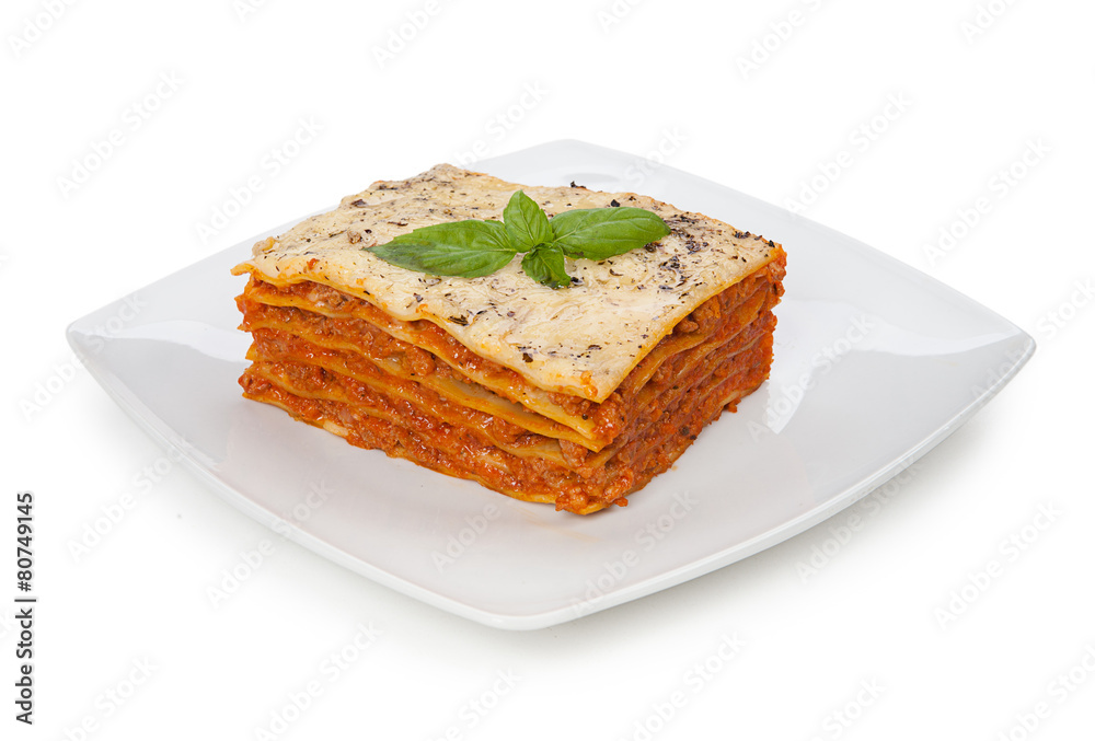 Tasty lasagna on a plate isolated on white background Tasty lasagna on a plate isolated on white background
