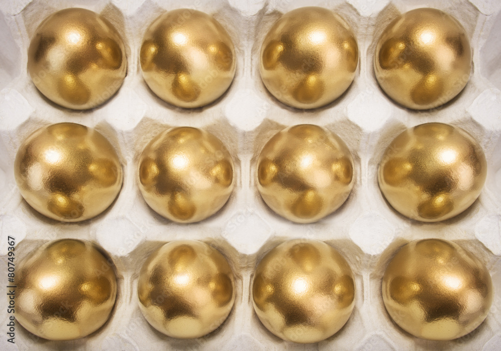 many of gold eggs in container many of gold eggs in container