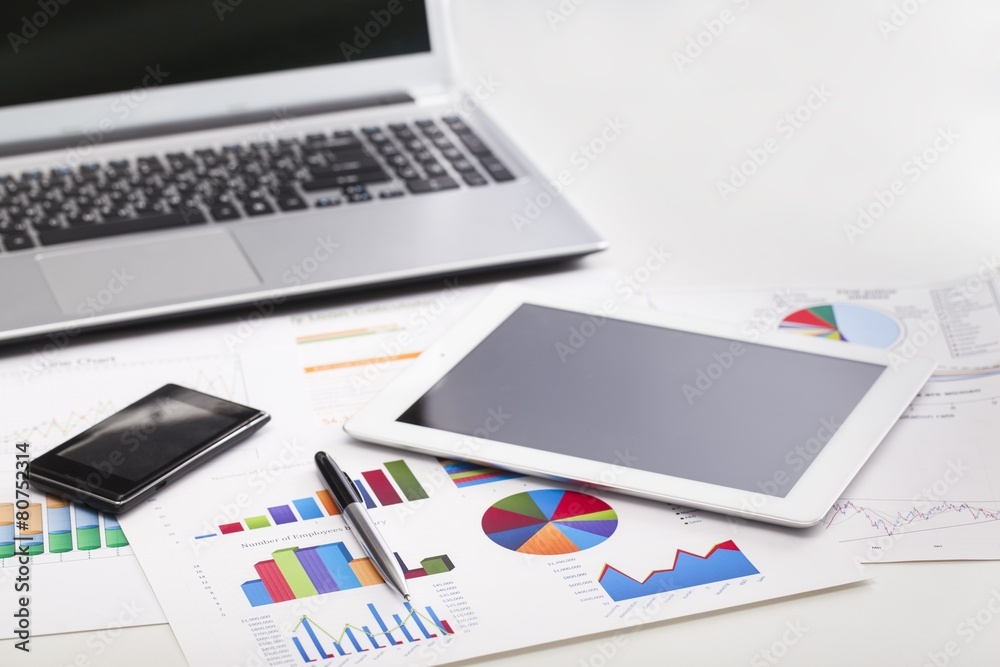 Market. Financial charts on the table with tablet phone and pen Market. Financial charts on the table with tablet phone and pen