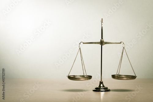 Cuadro en lienzo Justice. Law scales on table. Symbol of justice