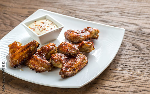 Baked chicken wings with spicy sauce