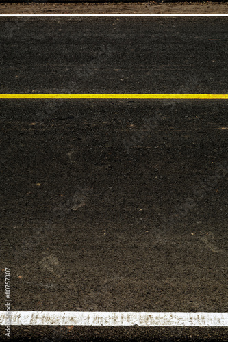 Yellow stripes on the road © kulzfotolia