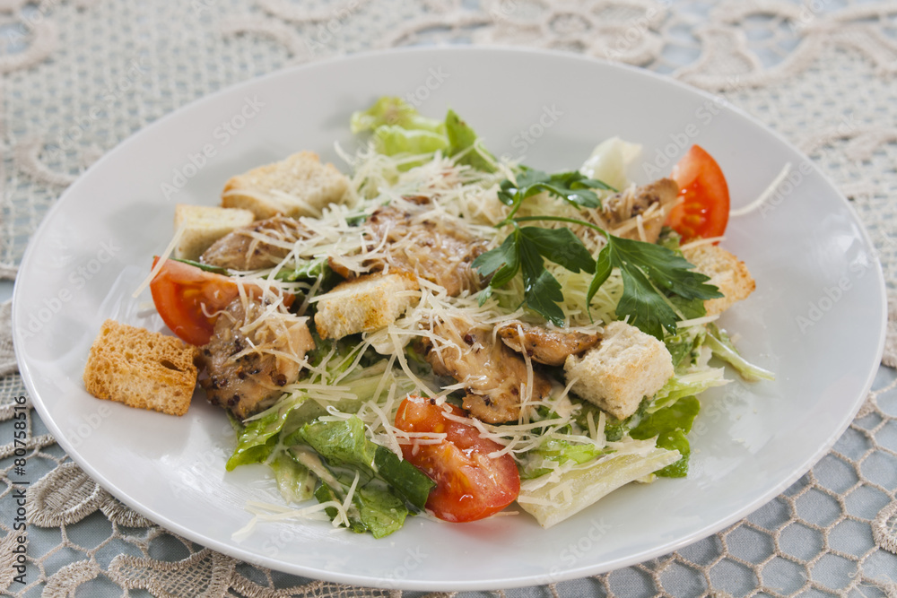 Meat salad with vegetables and croutons.