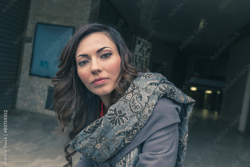 Beautiful girl posing in an urban context Beautiful girl posing in an urban context