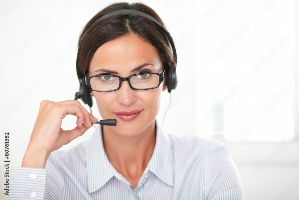 Seductive woman receptionist talking on headset Seductive woman receptionist talking on headset