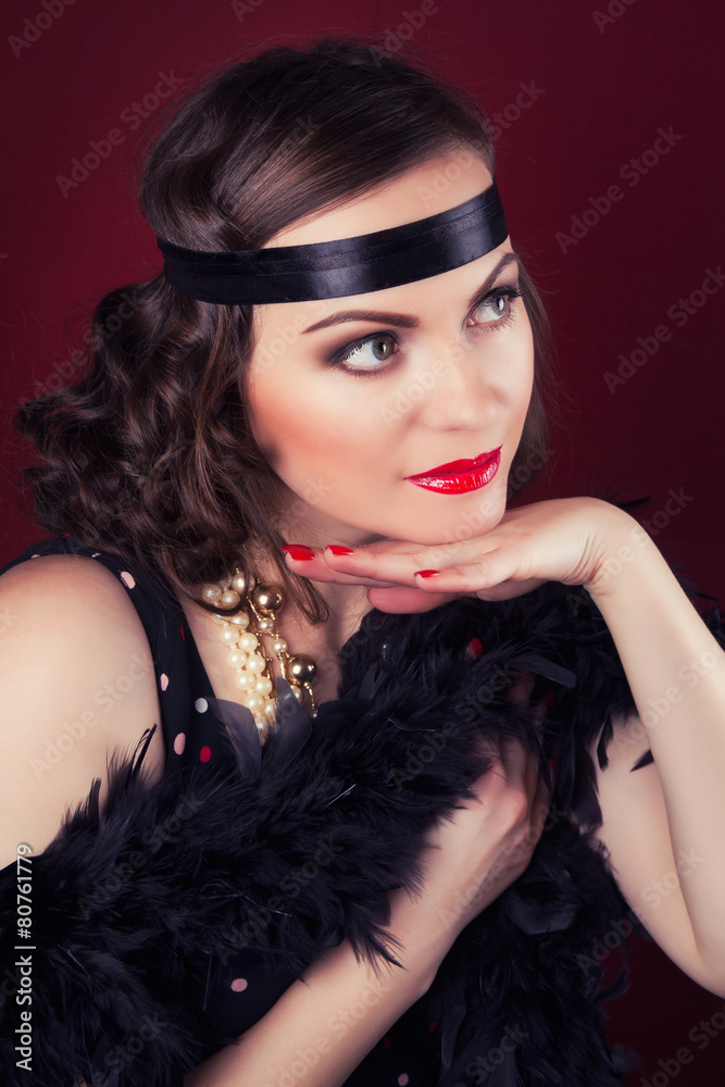 beautiful retro woman posing against wine red background beautiful retro woman posing against wine red background