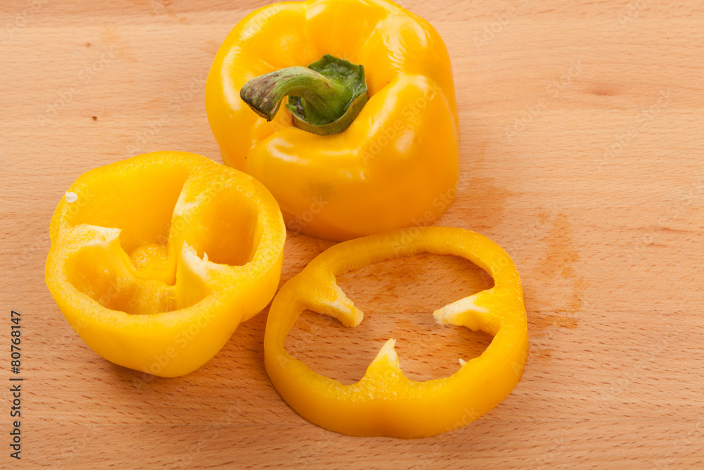 Cut yellow bell pepper on cutting board Cut yellow bell pepper on cutting board