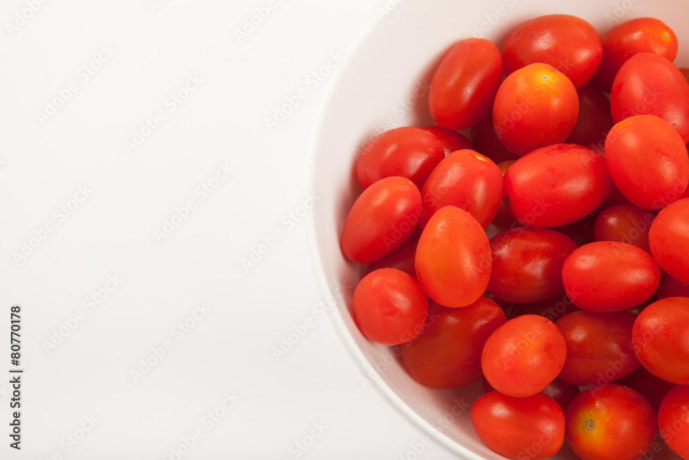Red cherry tomatoes in a bowl