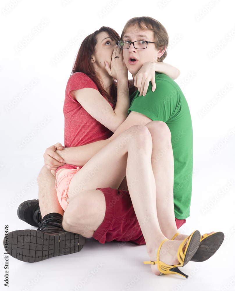 Scared Couple Sitting on the Floor While Hugging Scared Couple Sitting on the Floor While Hugging
