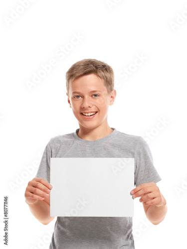 Smiling boy hold white blank paper