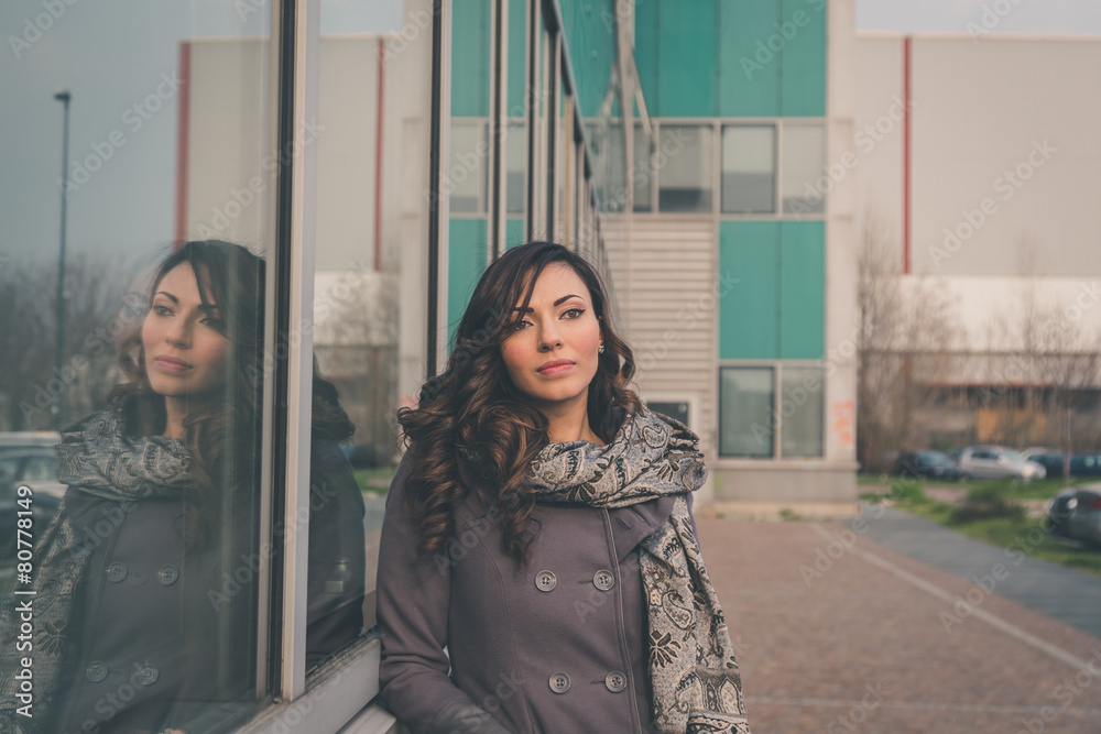 Fototapeta premium Beautiful girl posing in an urban context