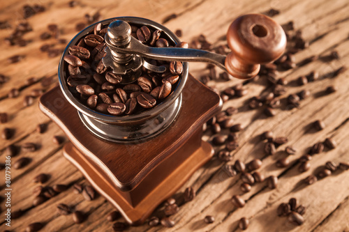 Vintage manual coffee grinder with coffee beans