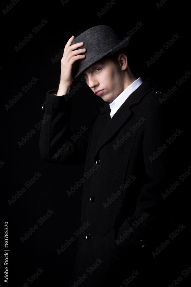 Man touching his hat Man touching his hat