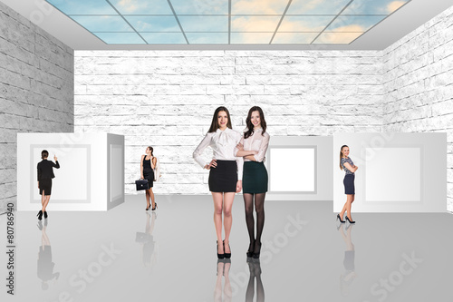 Business people walking on art gallery photo