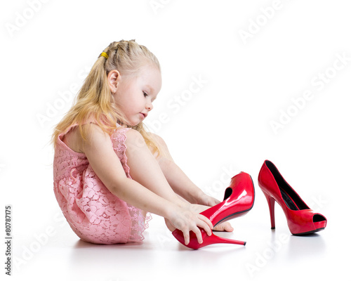 Little girl trying mother s...