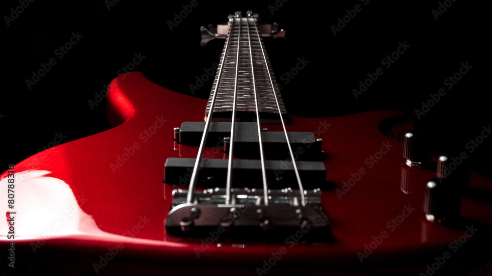 Obraz premium Bass guitar close-up. Photo in low key