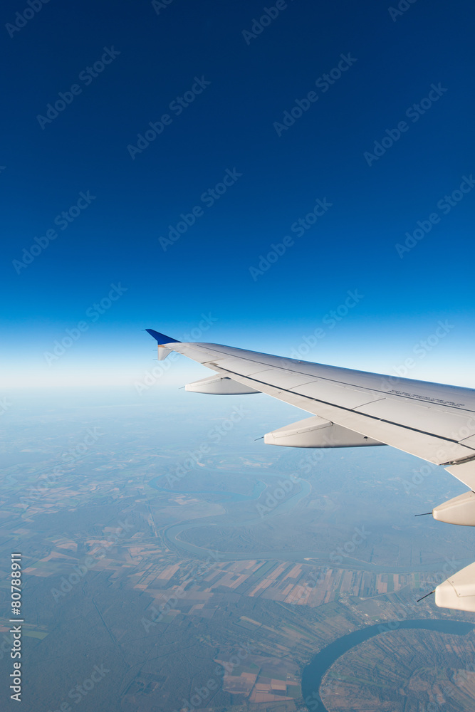 Airplane wing out of window Airplane wing out of window