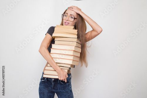 girl with stacked books