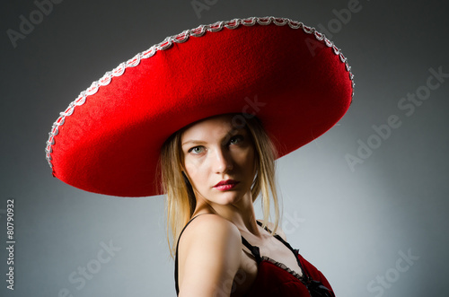 Woman wearing sombrero hat in funny concept