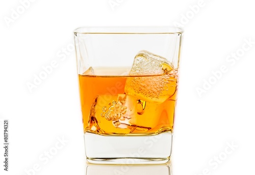 whiskey in glass with ice on white background