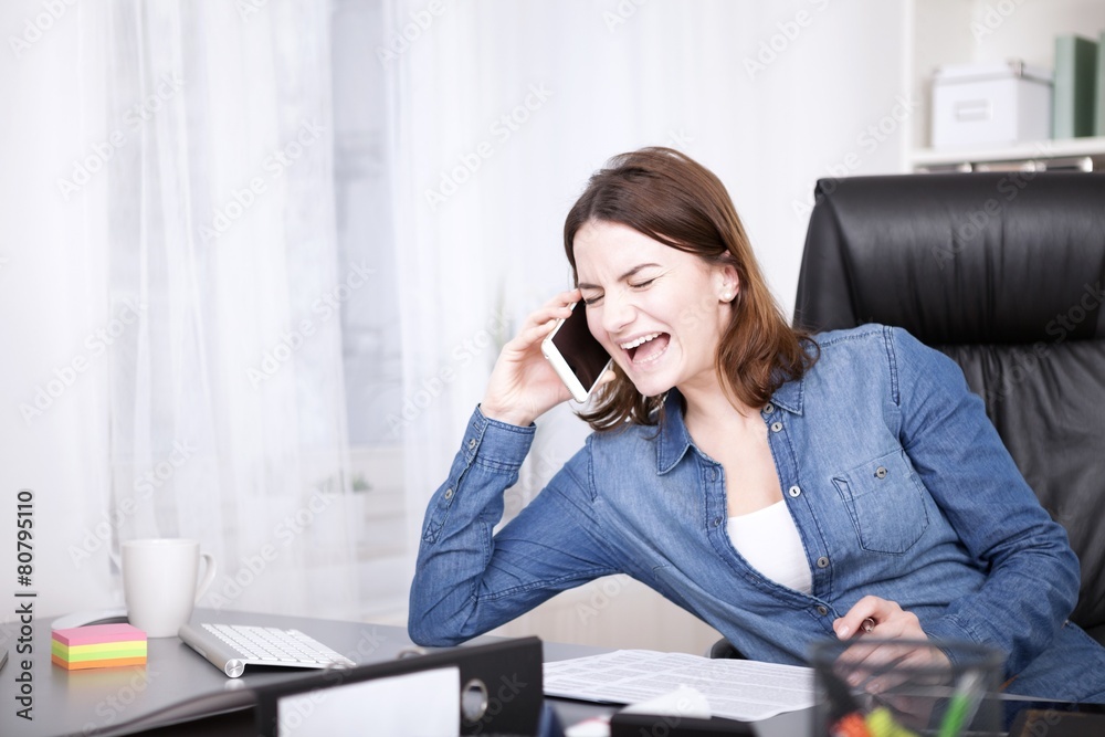 Office Woman Laughing While Talking on the Phone Office Woman Laughing While Talking on the Phone