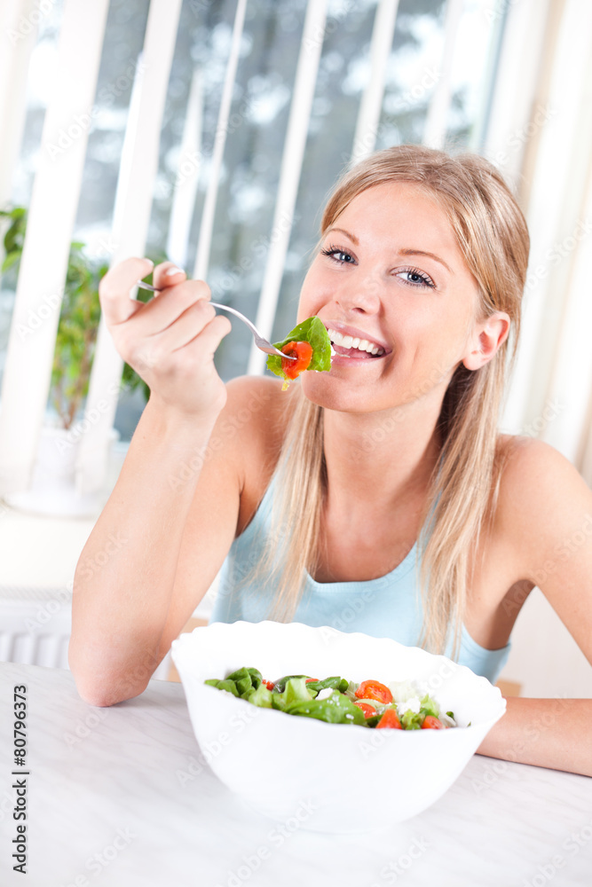 Woman eating salad, healthy eating concept Woman eating salad, healthy eating concept