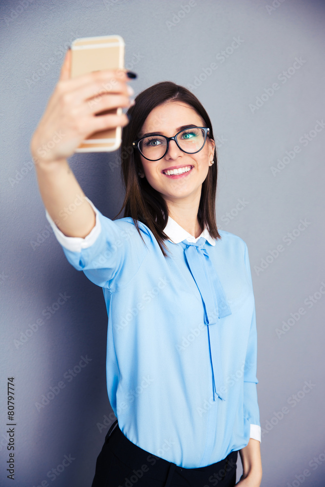 Smiling businesswoman making selfie photo Smiling businesswoman making selfie photo