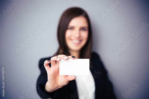 Woman holding blank card. Focus on card