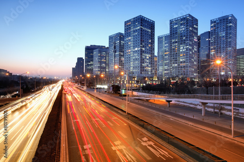 Moving car with blur light through city © Li Ding