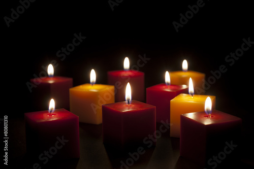 candles lighting in the darkness