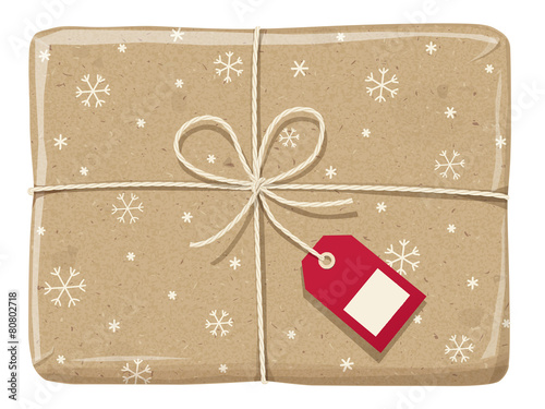 Parcel wrapped up with a snowflake paper, tied up  with twine