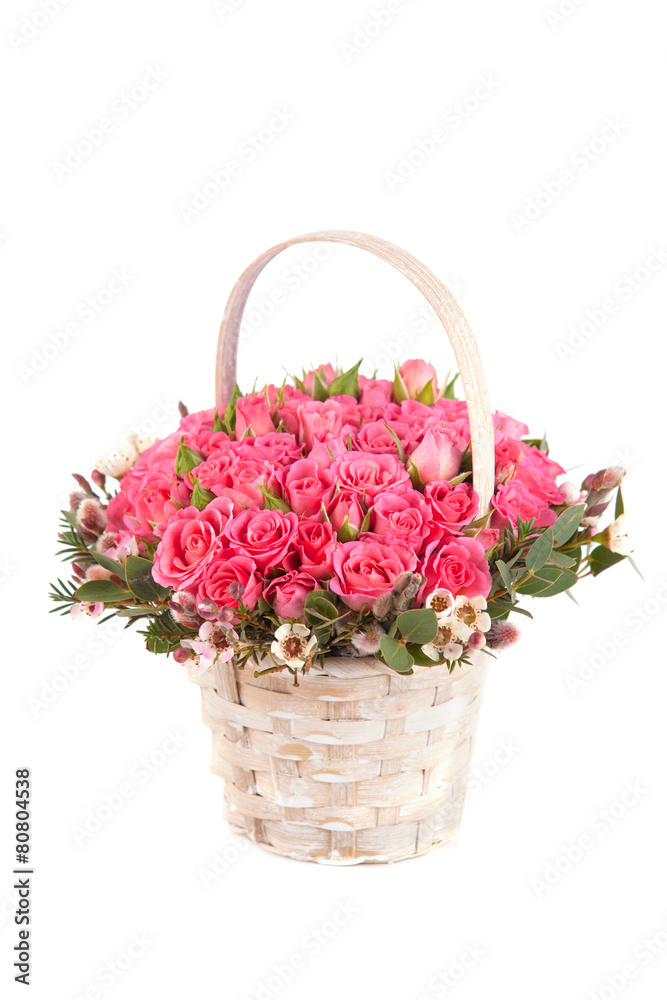 beautiful bouquet of pink roses in basket isolated on white back