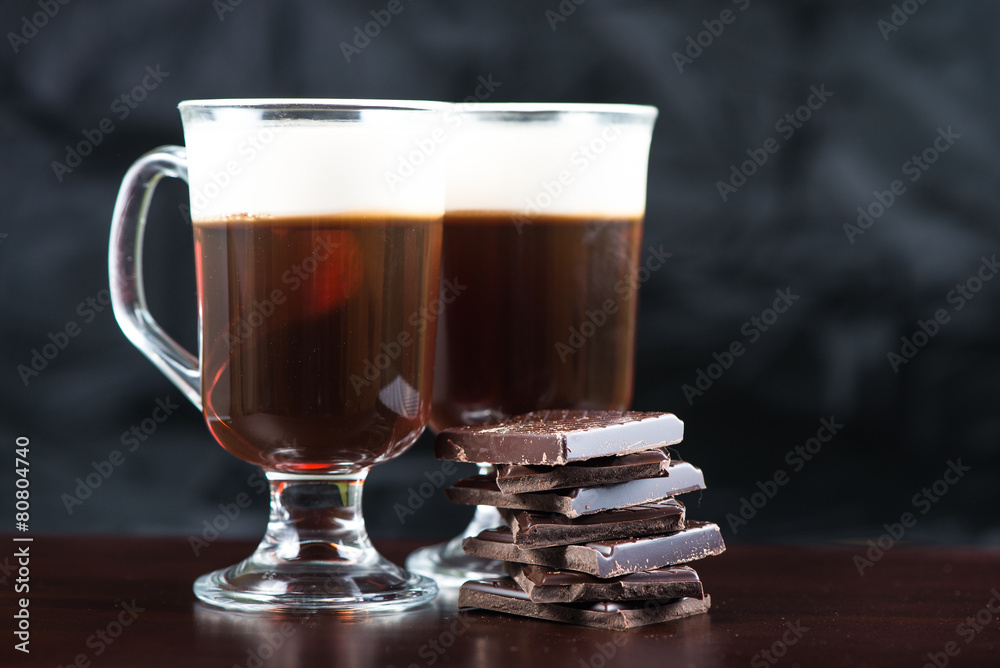 traditional strong irish coffee on wooden bar with dark chocolat traditional strong irish coffee on wooden bar with dark chocolat