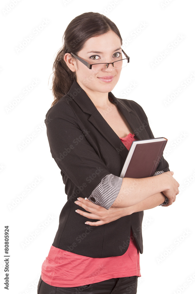 portrait of pretty female teacher wearing glasses and holding portrait of pretty female teacher wearing glasses and holding