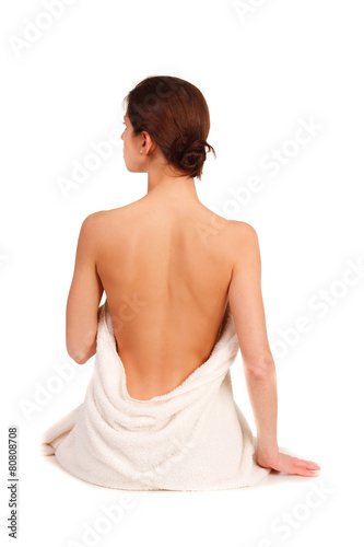 beautiful woman in spa sitting with a back