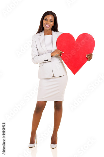 young african woman holding heart shape © michaeljung